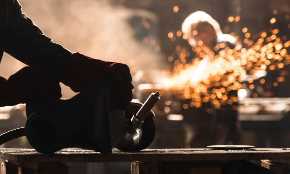 Industrial Worker at the factory welding closeup